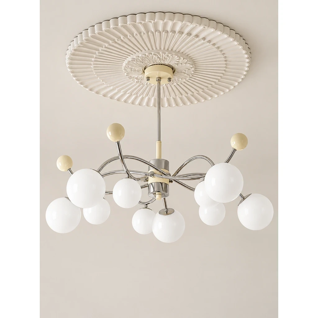 Nora Vintage Multi-Light Glass Iron Chandelier switched off in a neutral studio
