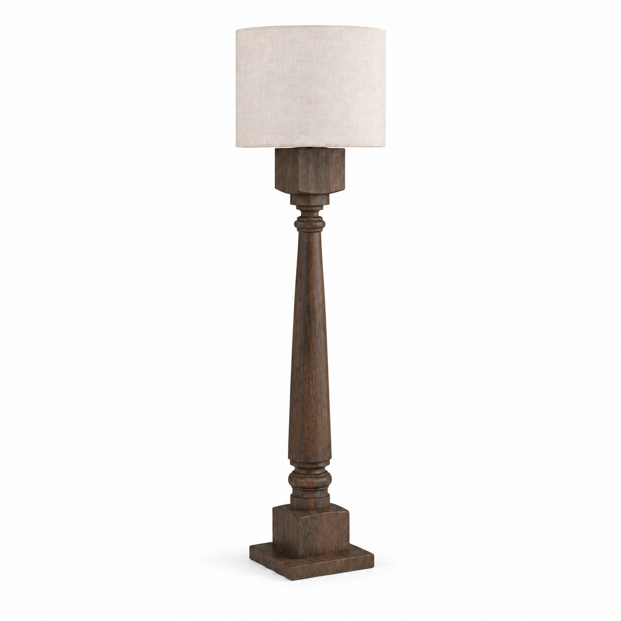 Dark Wood carved floor lamp with a fabric drum shade on white background