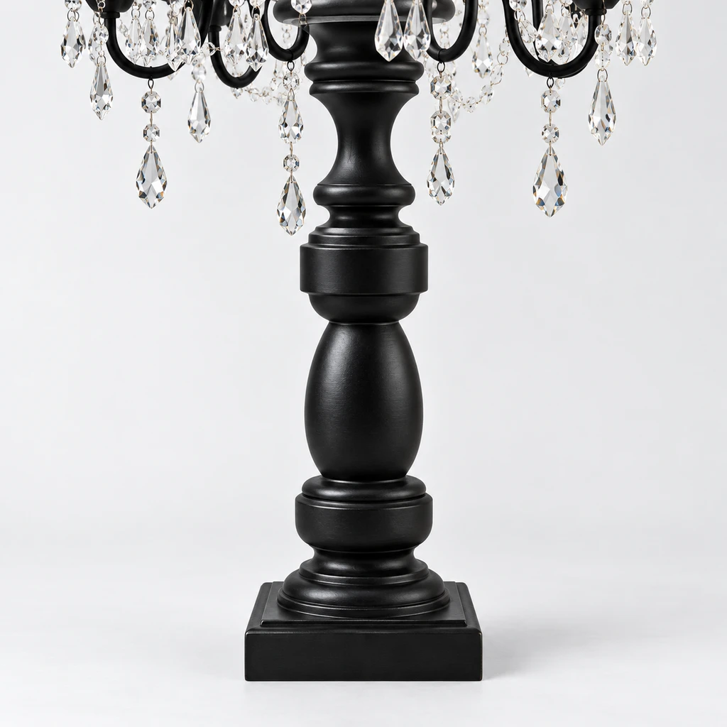 Close detail of the turned black pedestal and square foot