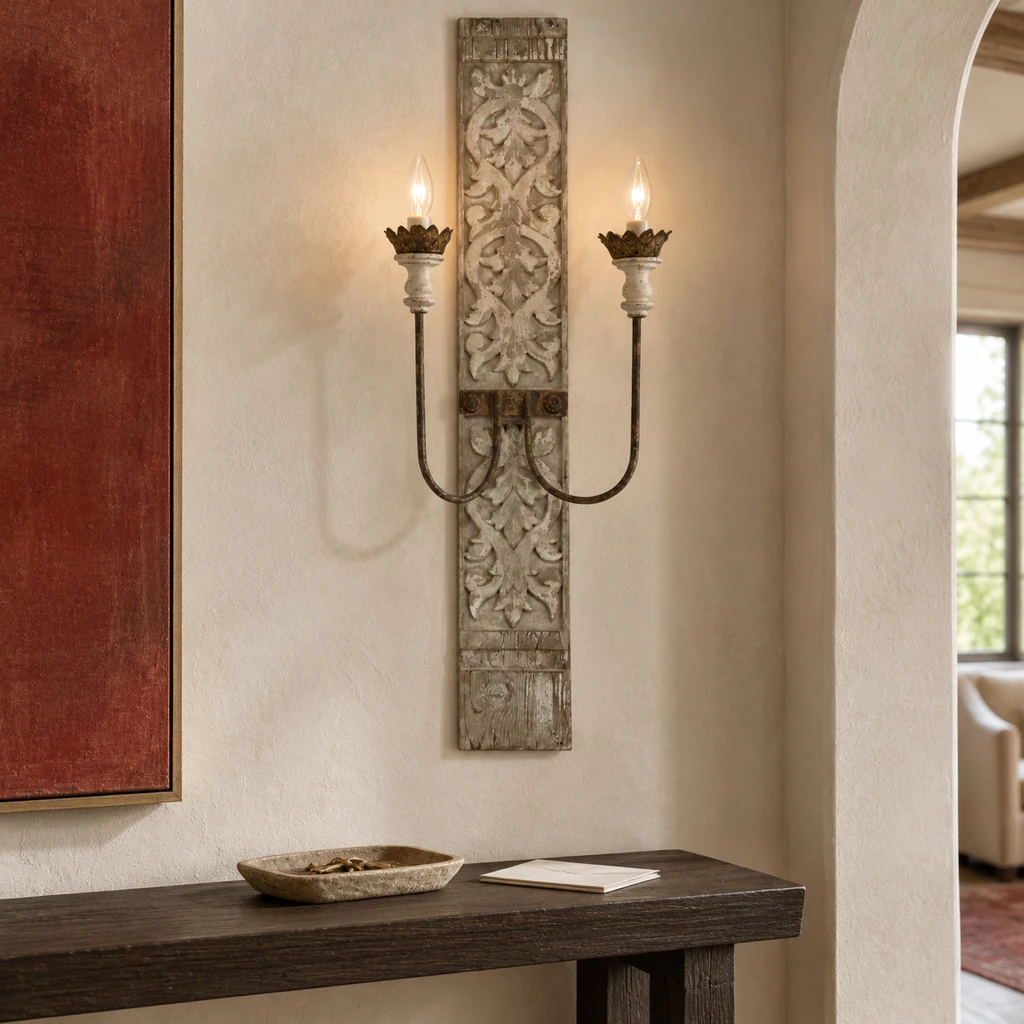 Marielle tall carved wall sconce above an entry console