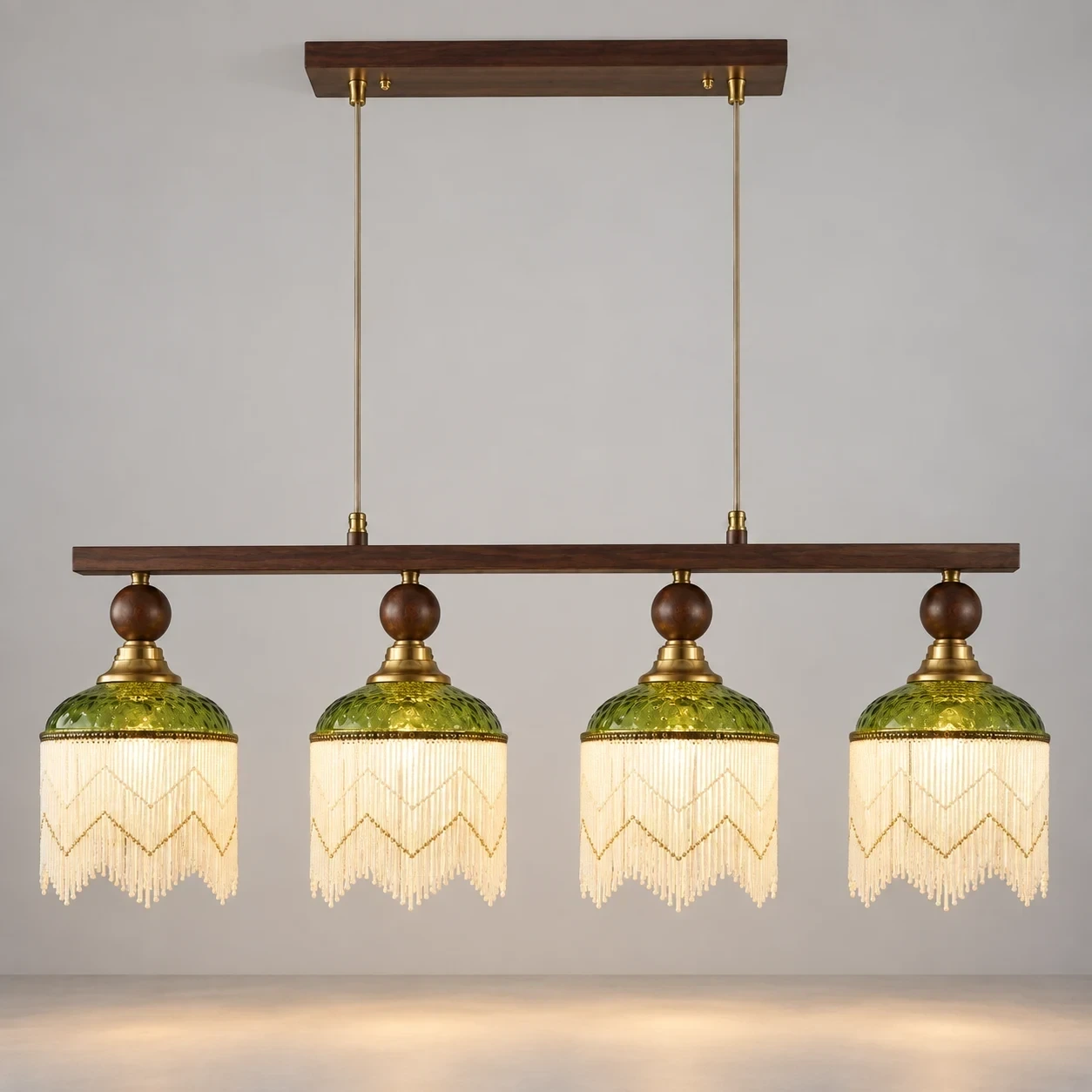 Wushlp Vintage Four-Light Green Glass Linear Pendant Light switched on in a neutral studio