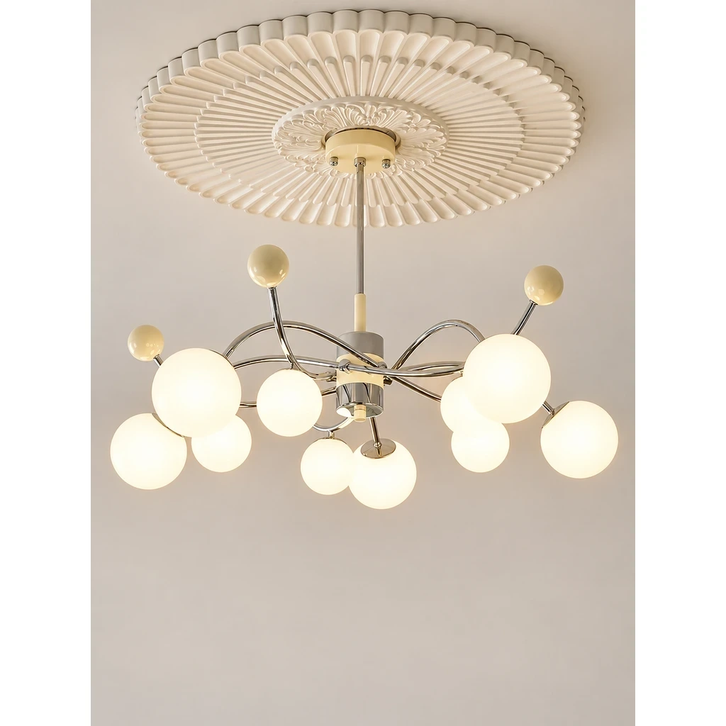 Nora Vintage Multi-Light Glass Iron Chandelier switched on in a neutral studio