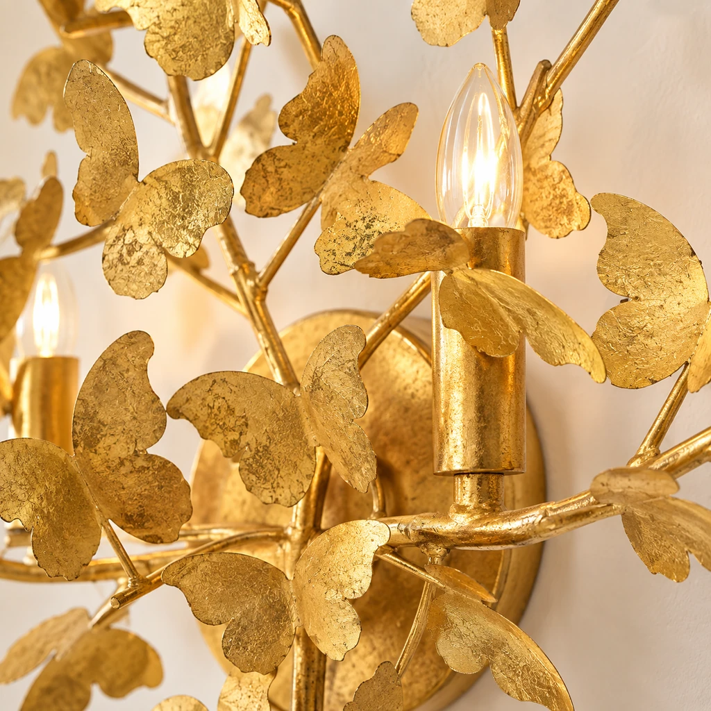 Close detail of Nora candle-like socket among textured gold leaves