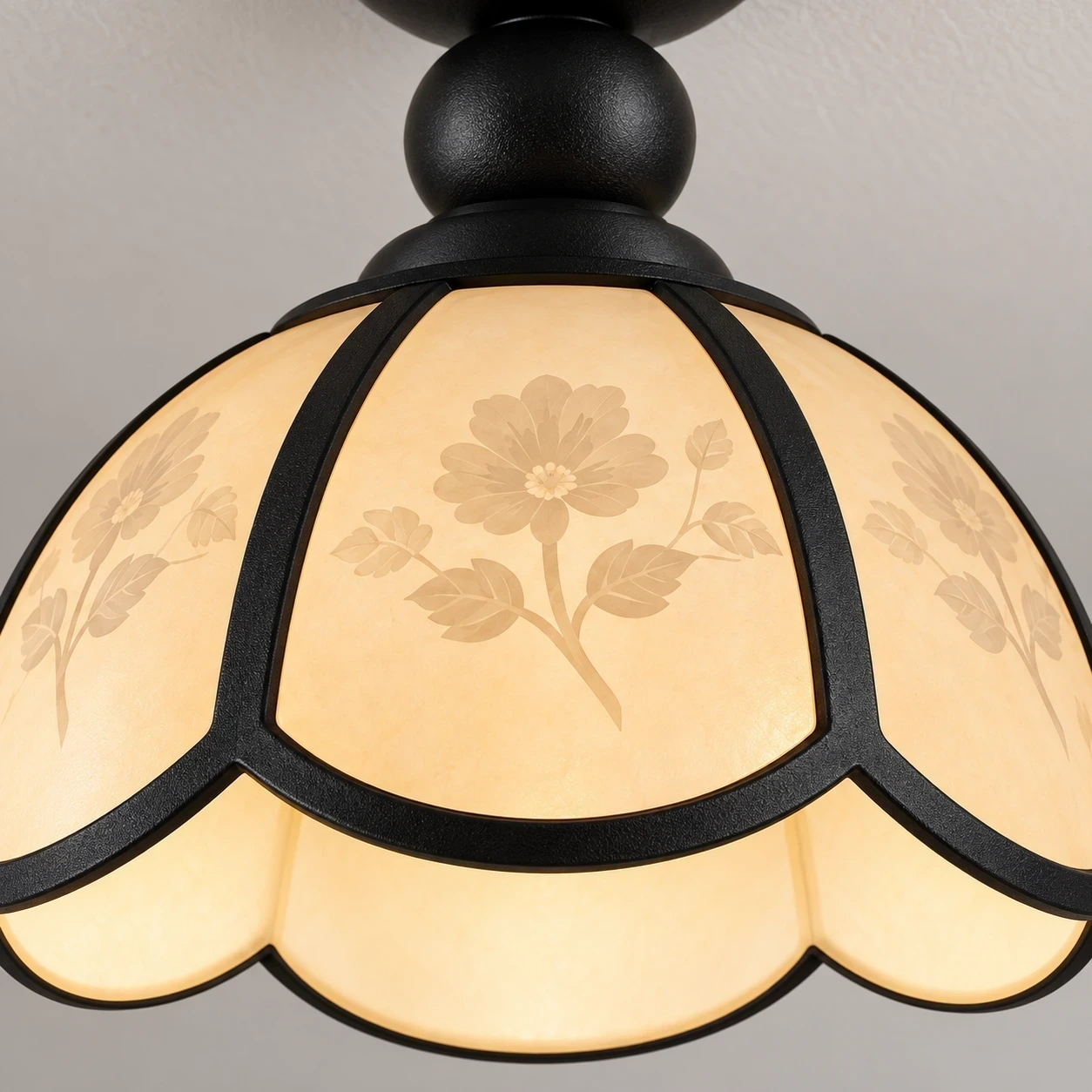 Close view of the cream scalloped acrylic petal shade with floral etching