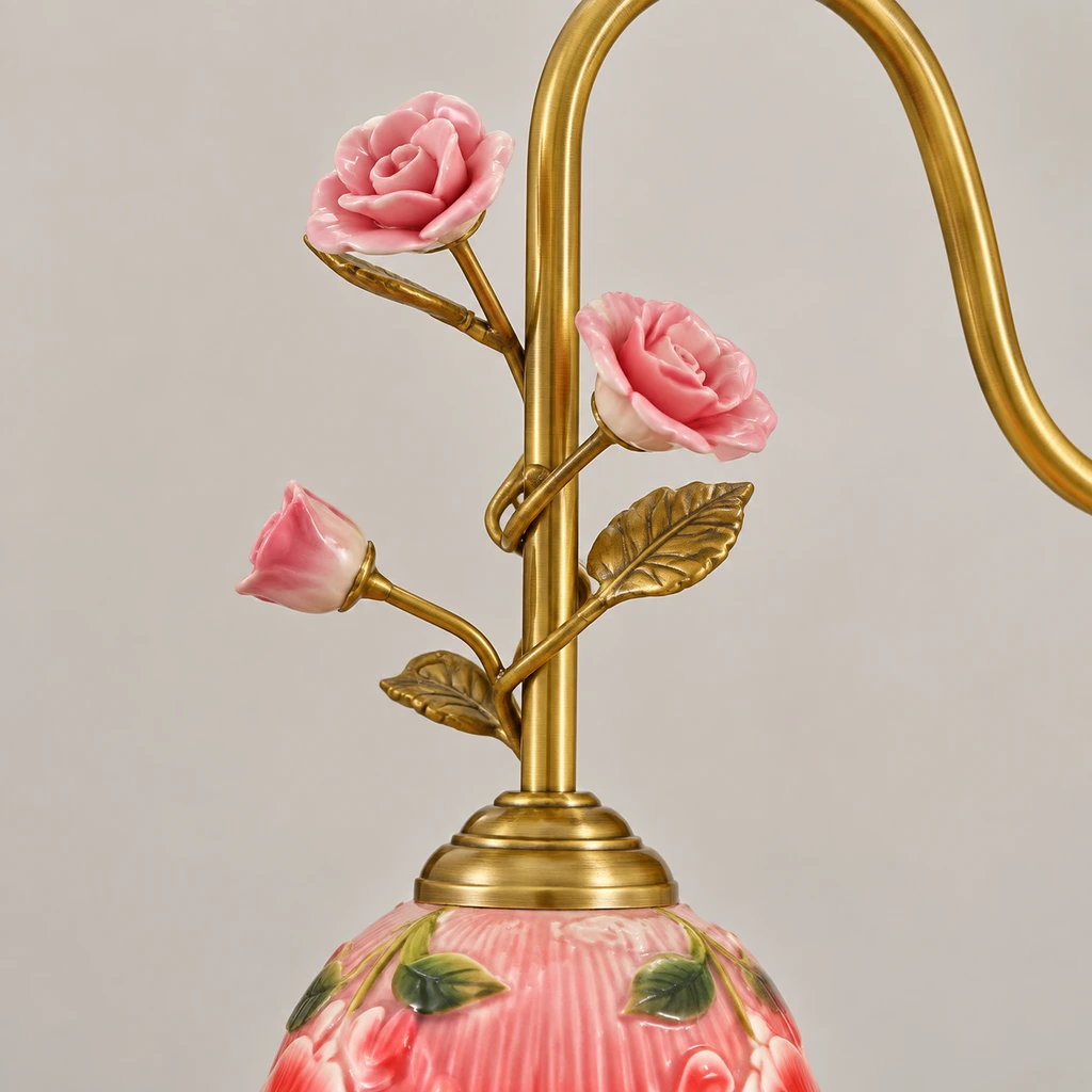 Close detail of the curved brass botanical branch and buds