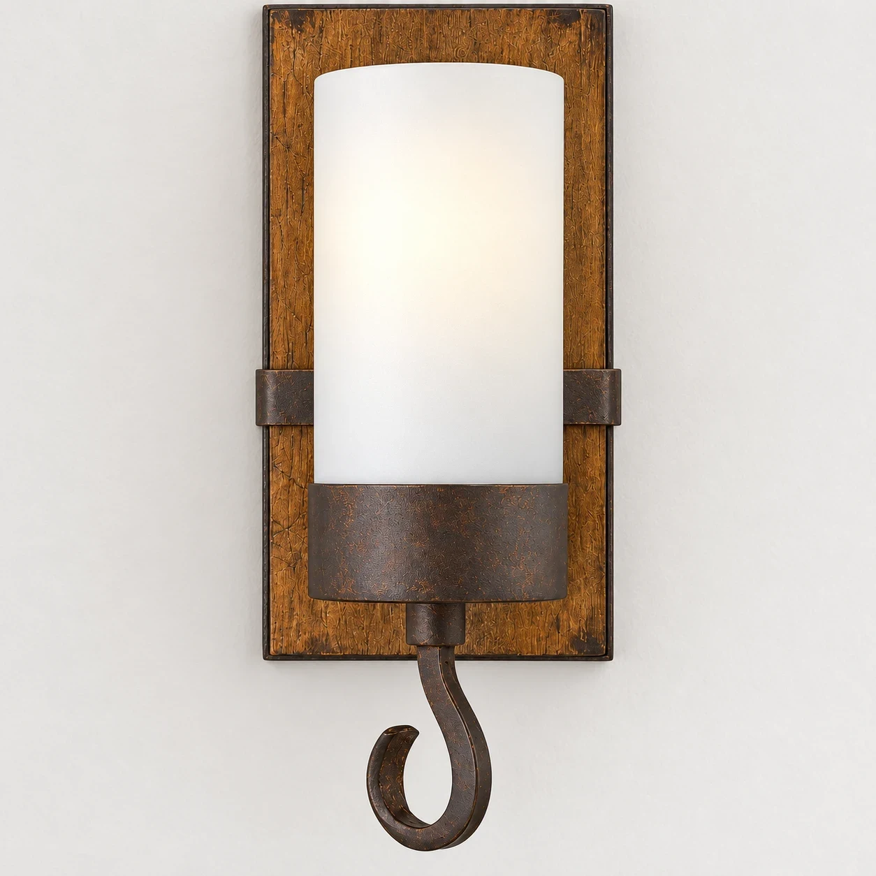 Close view of the frosted cylindrical glass and candle cup on the Wren sconce
