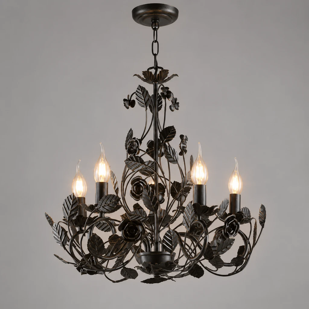 Cleo leaf metal chandelier illuminated in a neutral studio