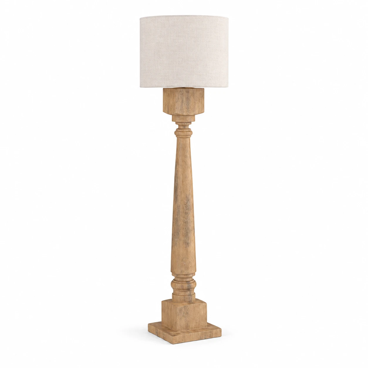 Natural Wood carved floor lamp with a fabric drum shade on white background
