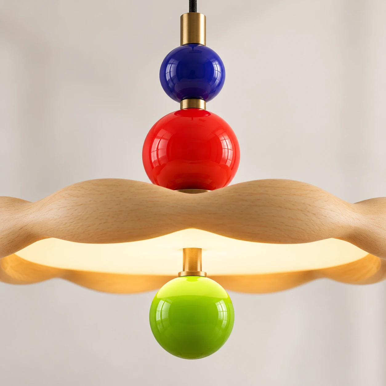 Close detail of blue red and green Memphis orbs on brass stem