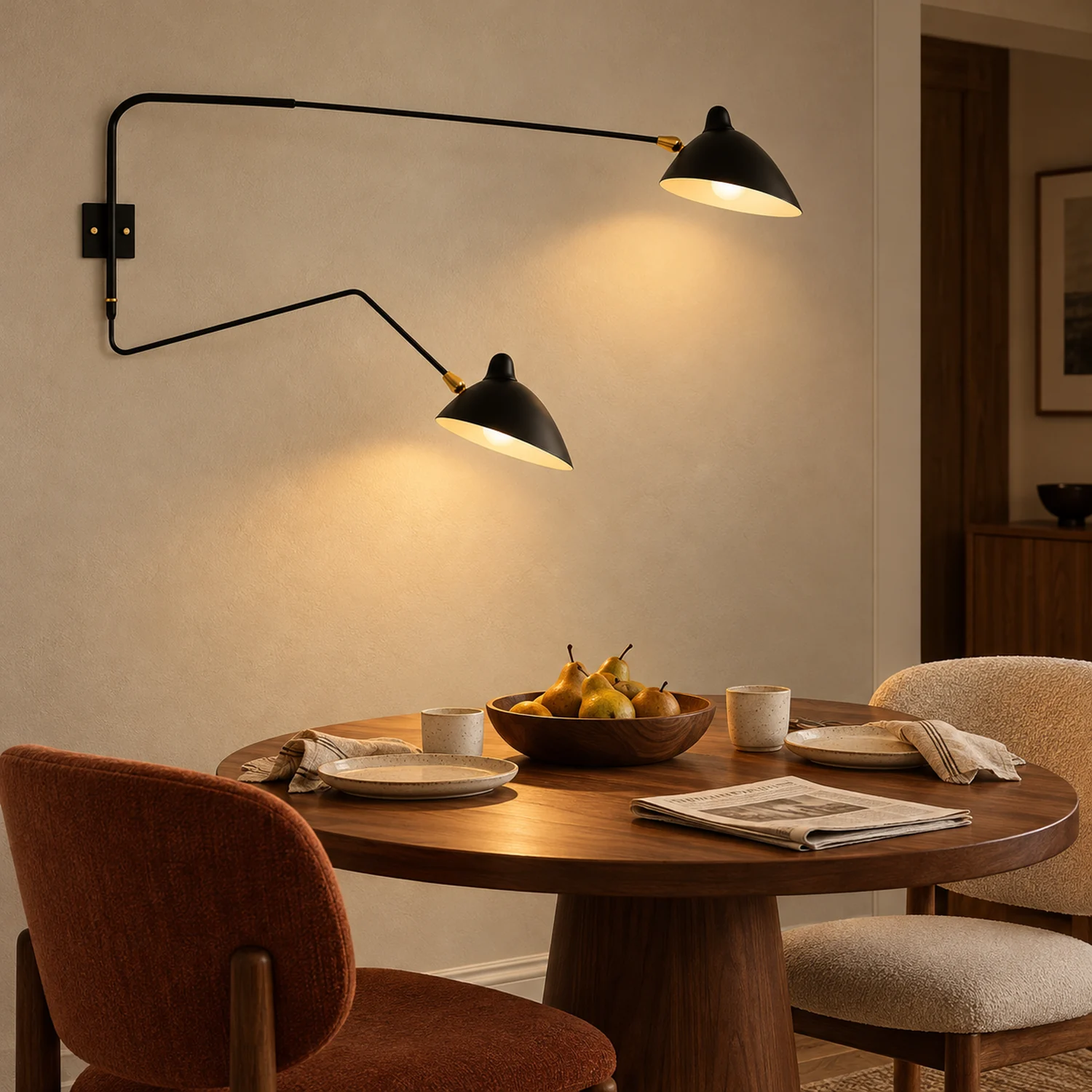 Black two-head wall lamp above a dining table