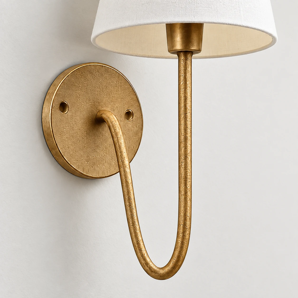 Vintage gold wall plate and U-shaped iron arm of the Mabel wall light