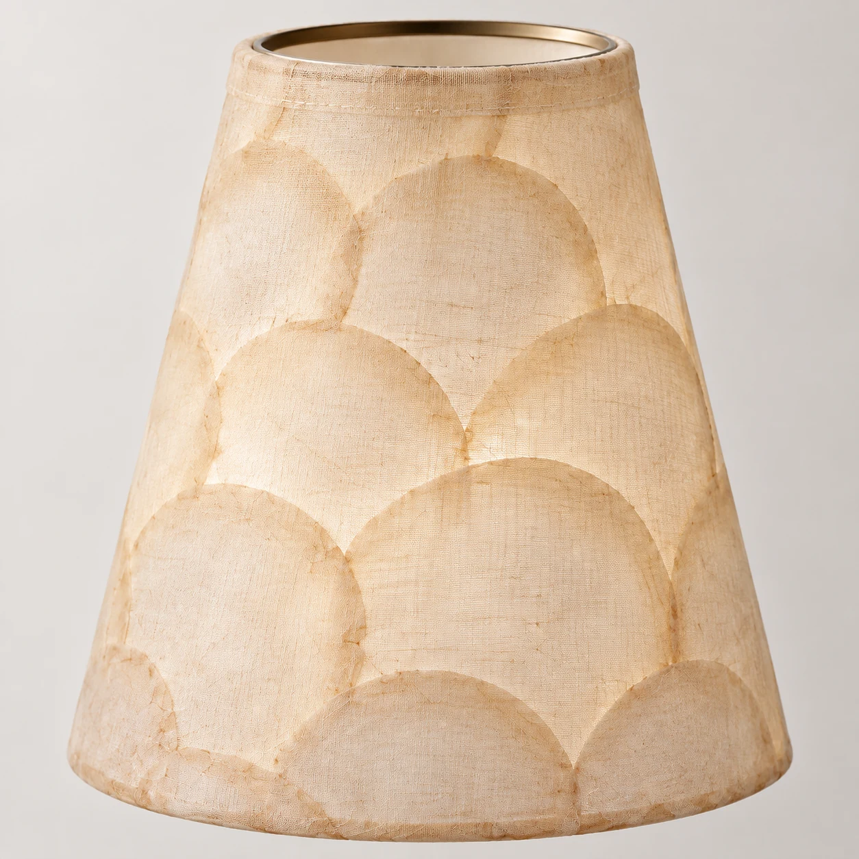 Scalloped fabric shade and textile edge of the Mabel wall light