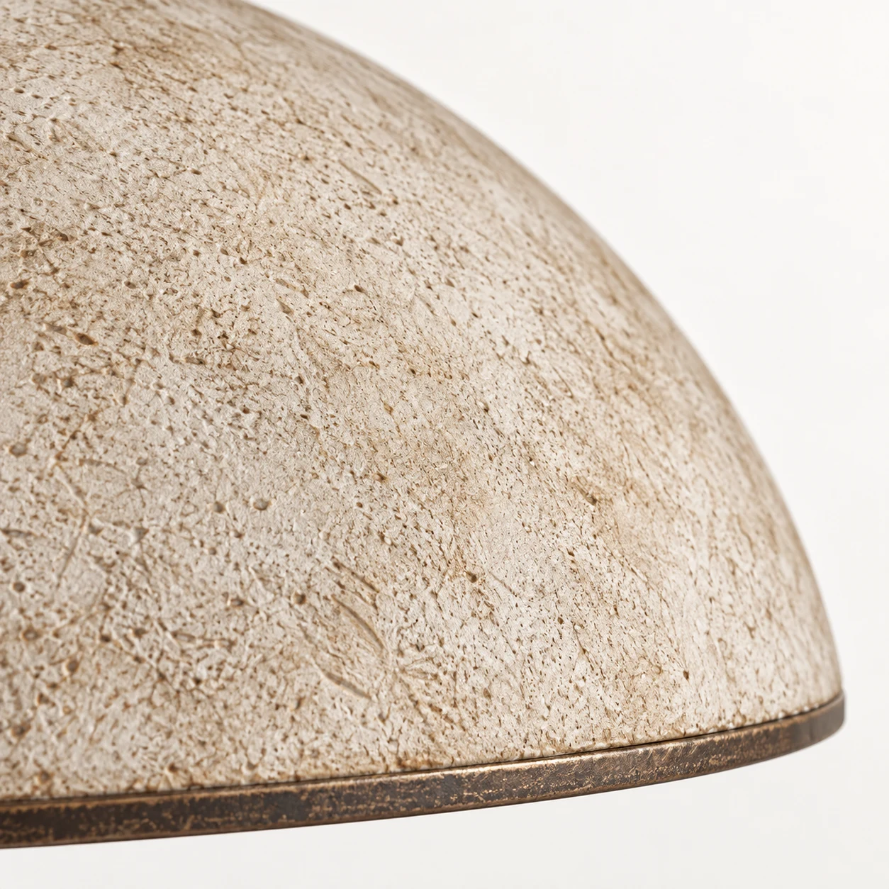 Textured resin dome and iron rim of the Clara ceiling light