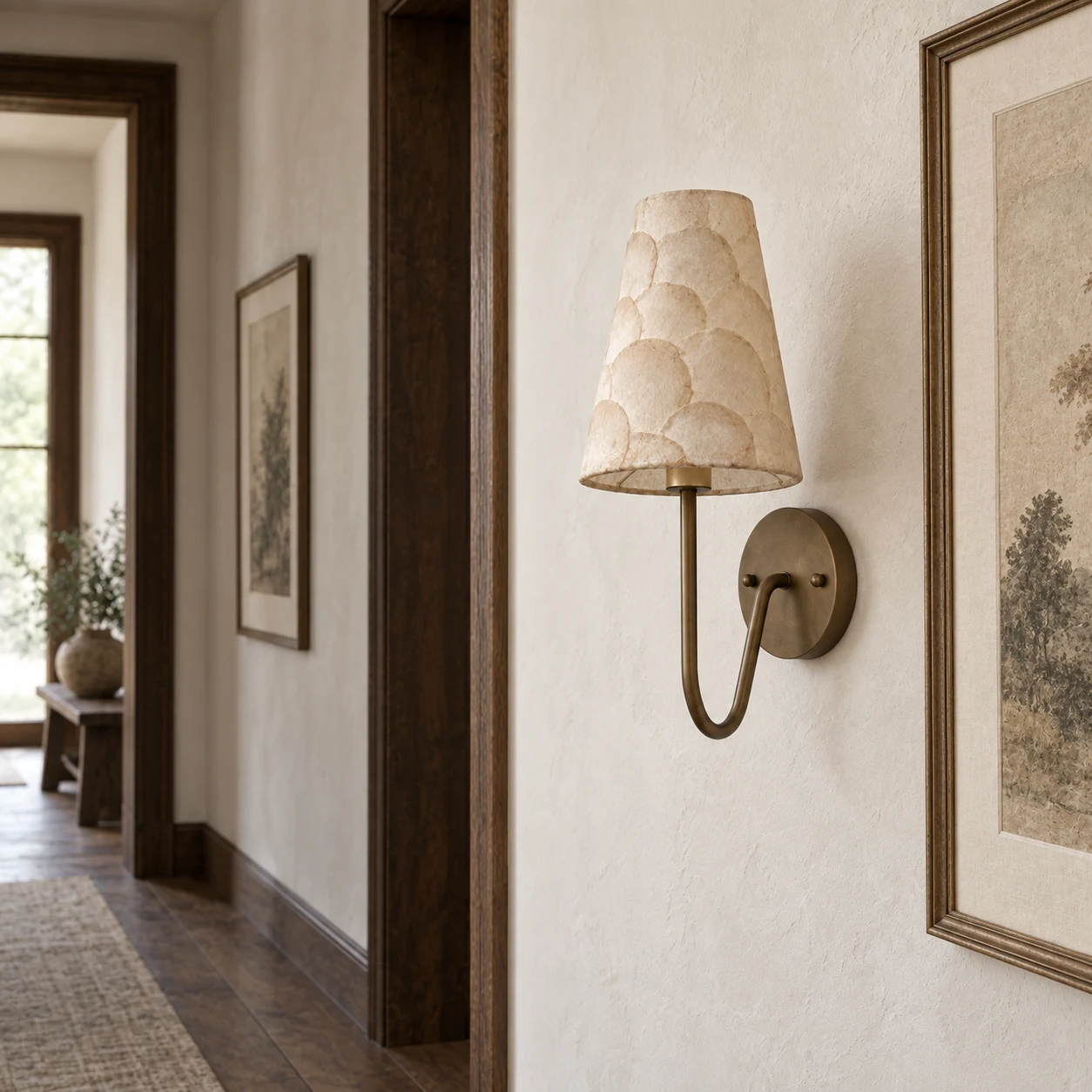 Mabel scalloped wall light in a gallery corridor