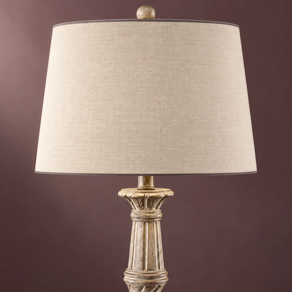 Close detail of the ivory fabric shade and carved upper column