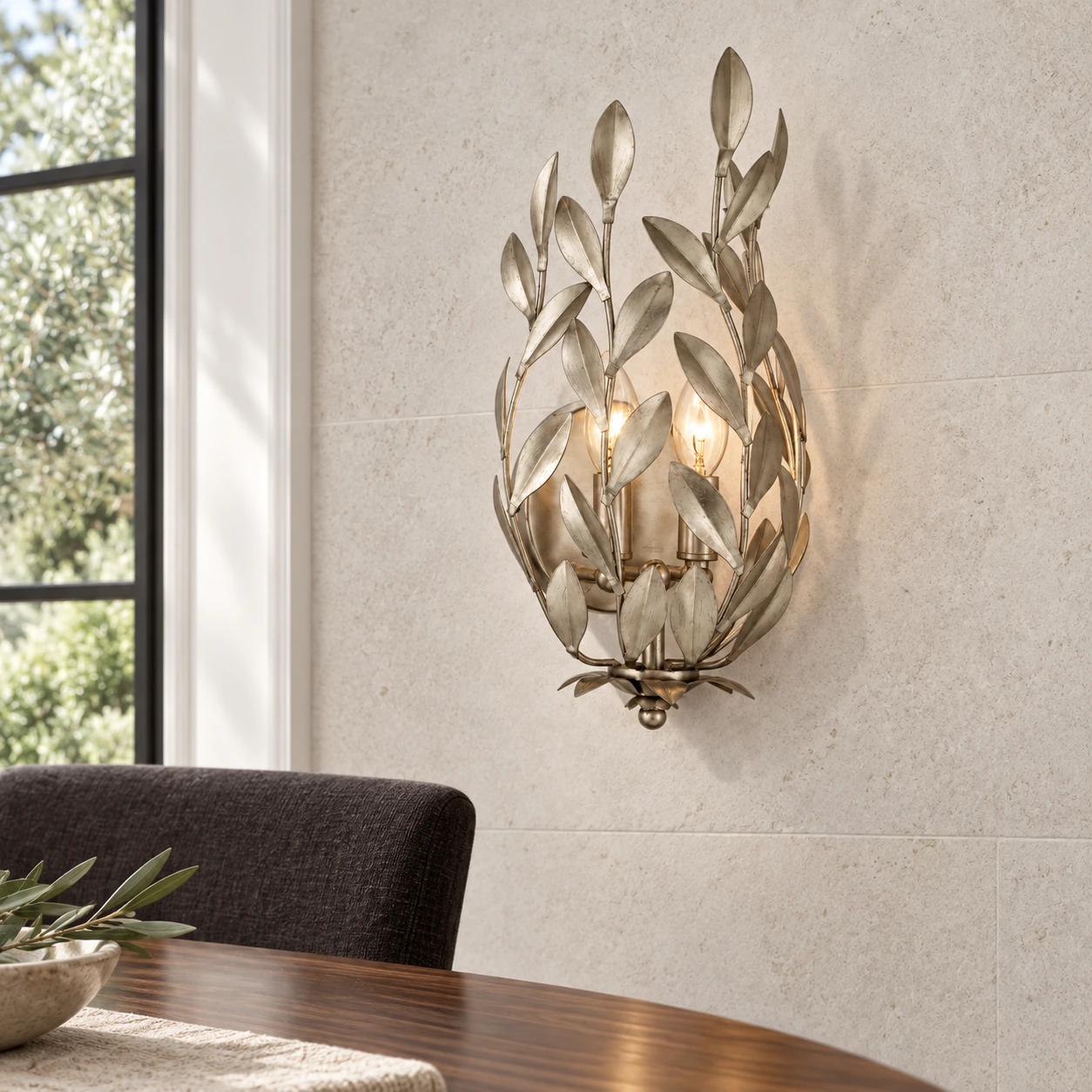 Silver Foil leaf wall sconce beside the dining area