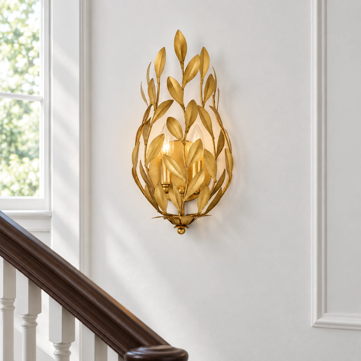 Gold Foil leaf wall sconce on a stair landing wall