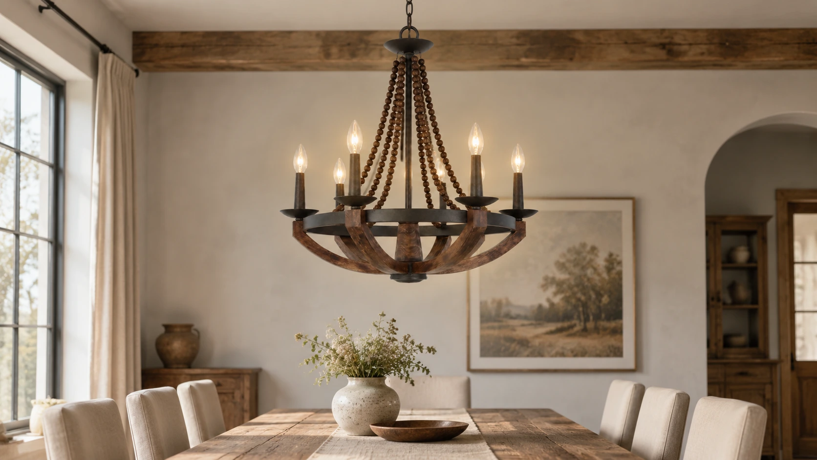 Rustic wood chandelier above a dining table in a natural neutral interior