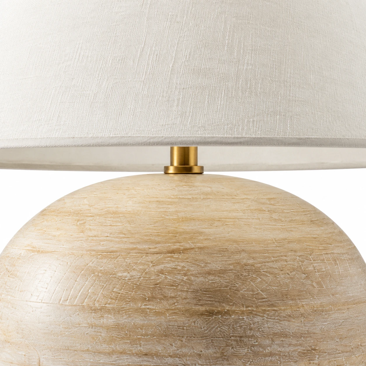 Close detail of the warm-metal neck and shade-to-body connection