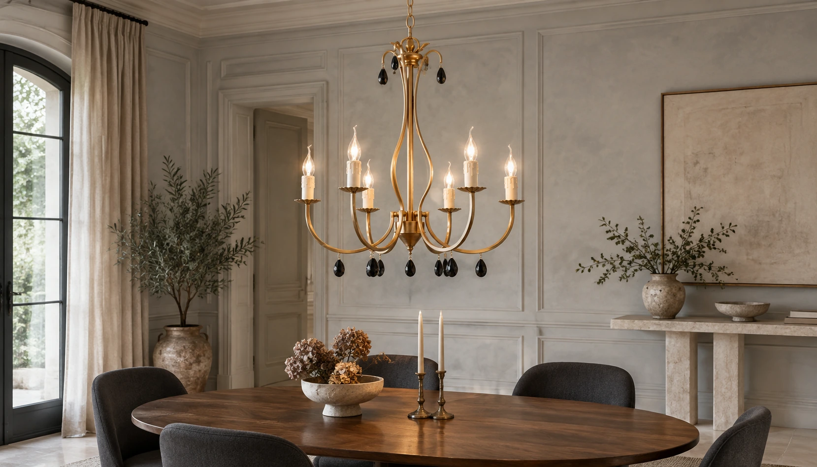 Celeste vintage gold crystal chandelier illuminated above a walnut dining table in an updated French-classical room