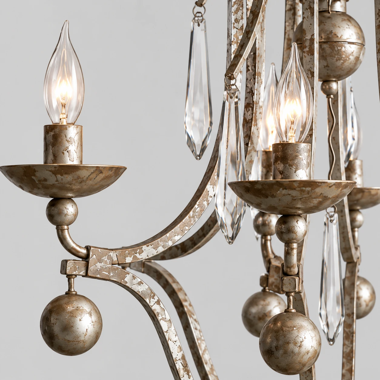 Close detail of the distressed iron arm and candle cup