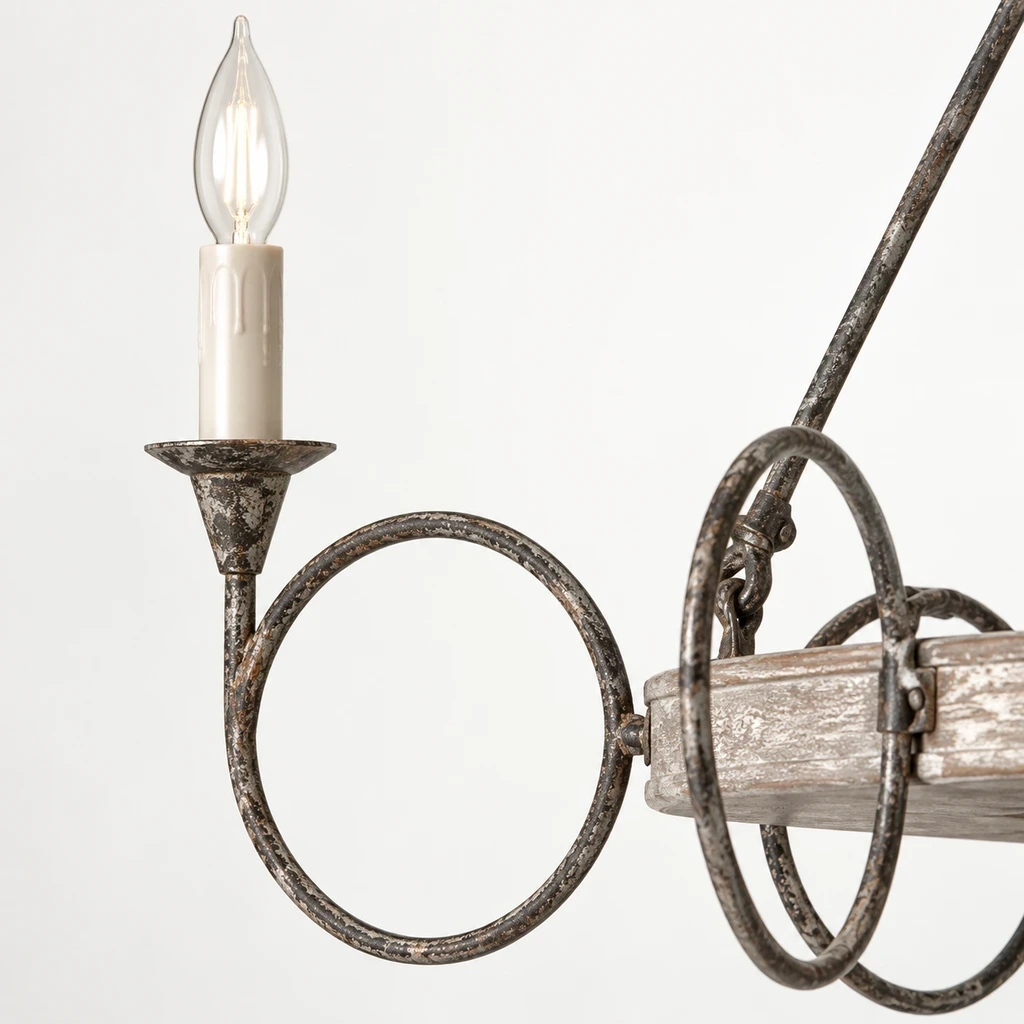 Close detail of the candle-style socket, drip-shaped bulb cover and distressed iron ring arm