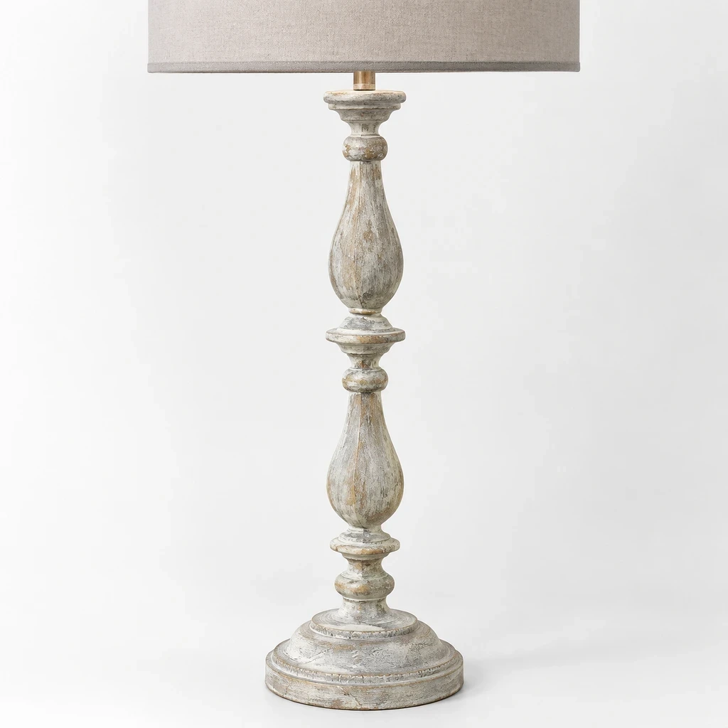 Close detail of the gray-trimmed linen shade and carved floral body
