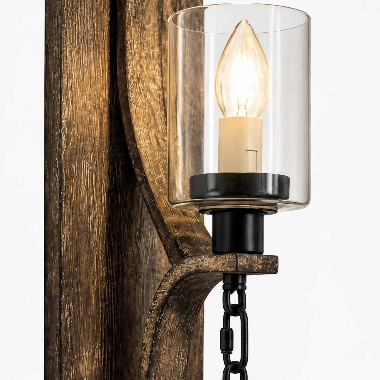 Close view of the wall sconce glass cylinder and candle-shaped bulb