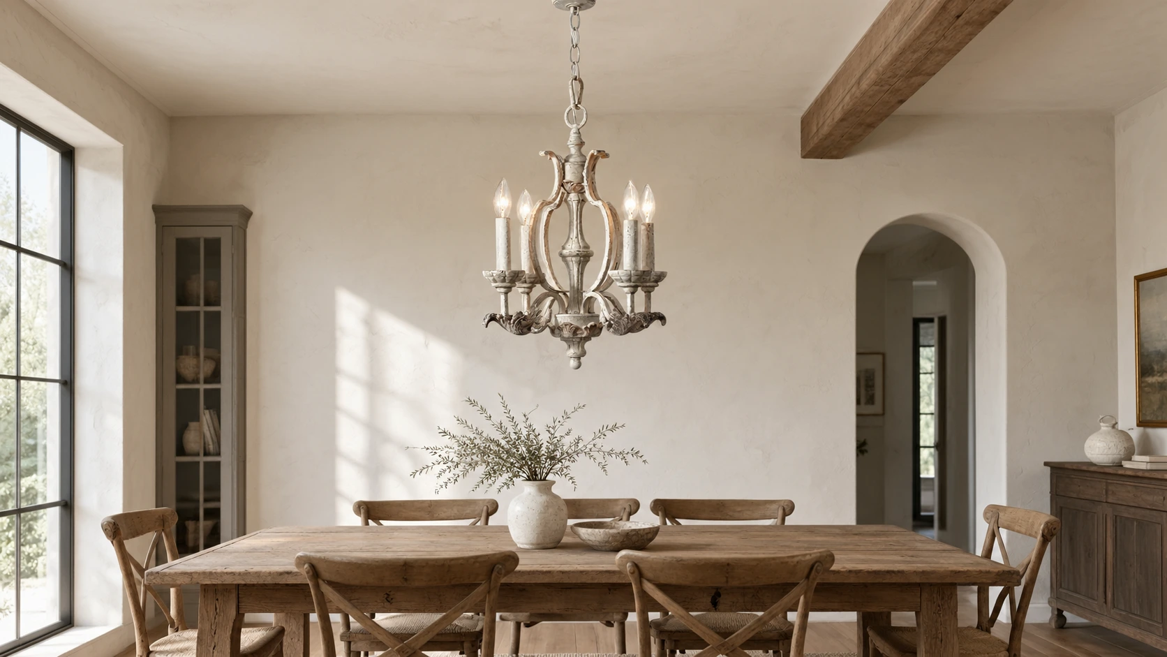 Vintage distressed wood chandelier above a dining table