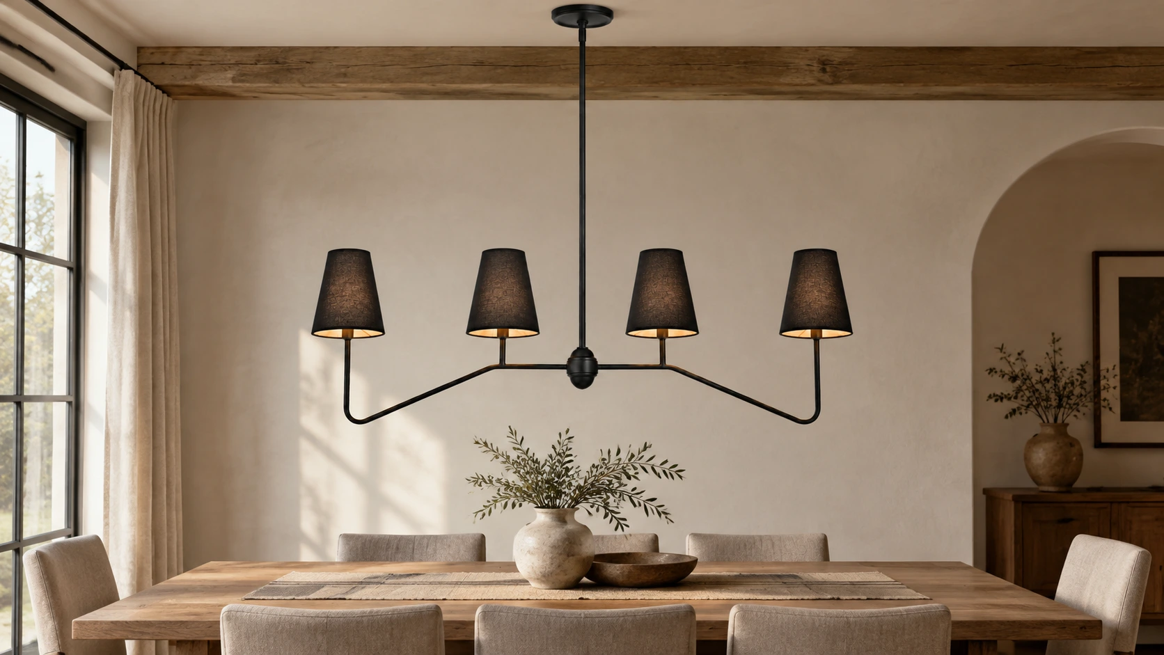 Black shade linear chandelier above a natural oak dining table