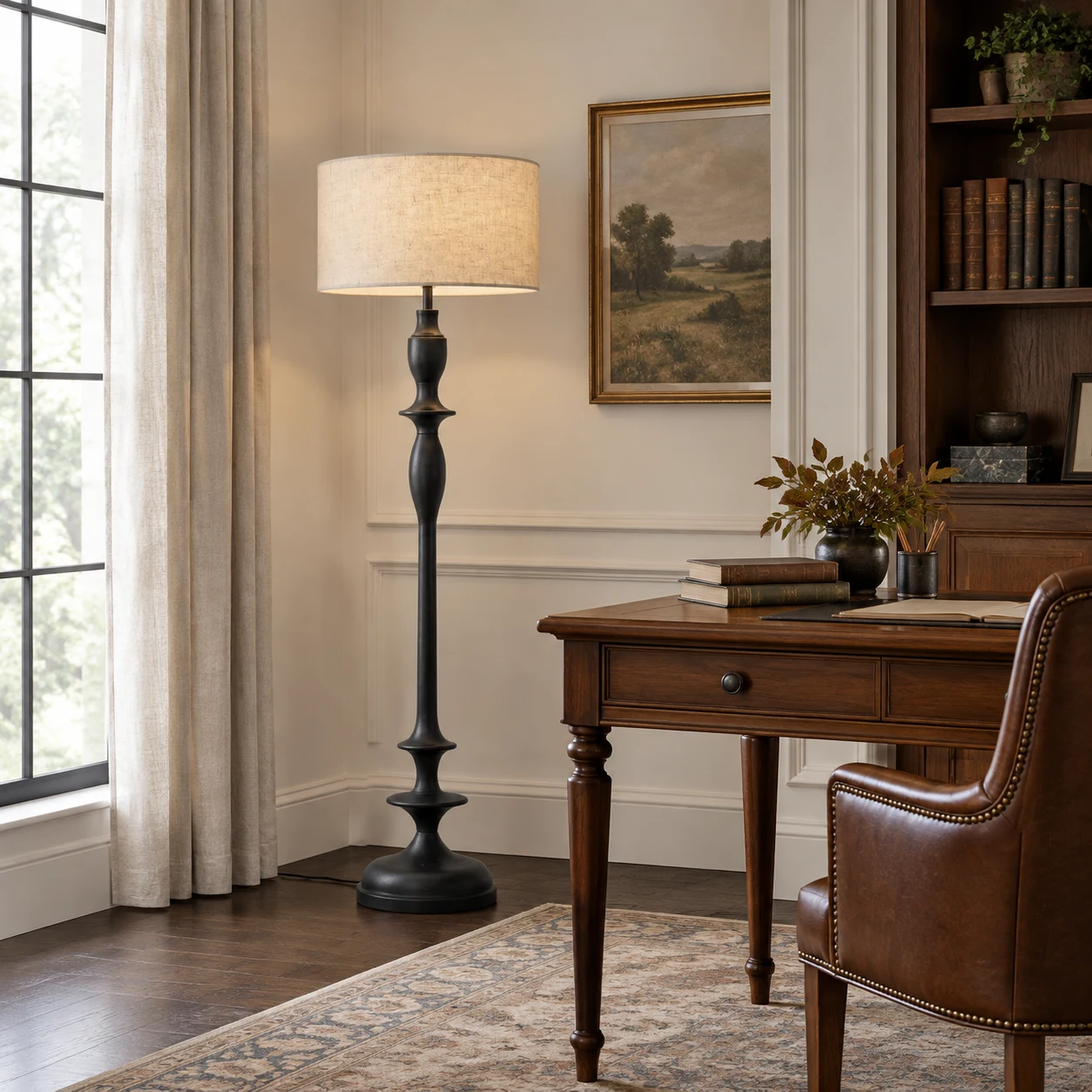 Black Camille floor lamp beside a walnut writing desk