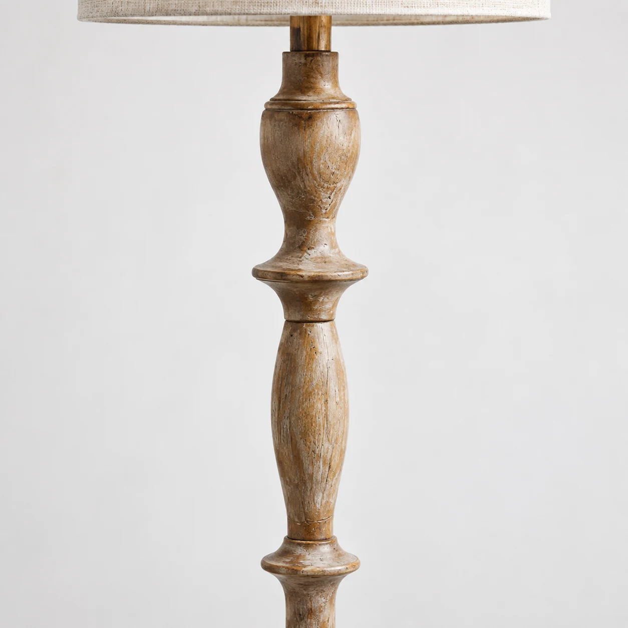 Turned solid-wood column with hand-finished relief