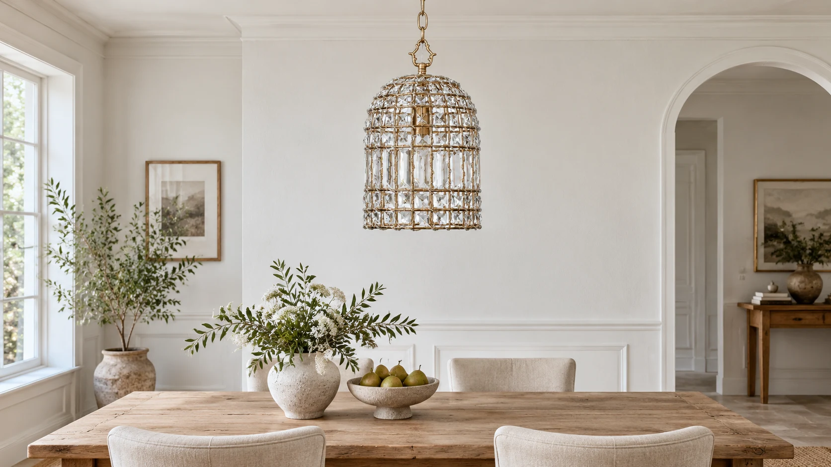 Clara single-light crystal cage pendant in a neutral dining room