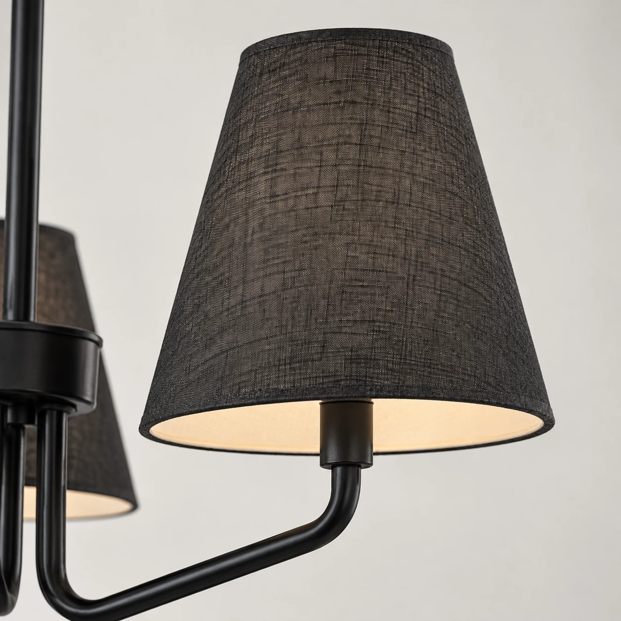 Woven cone fabric shade with softly lit interior