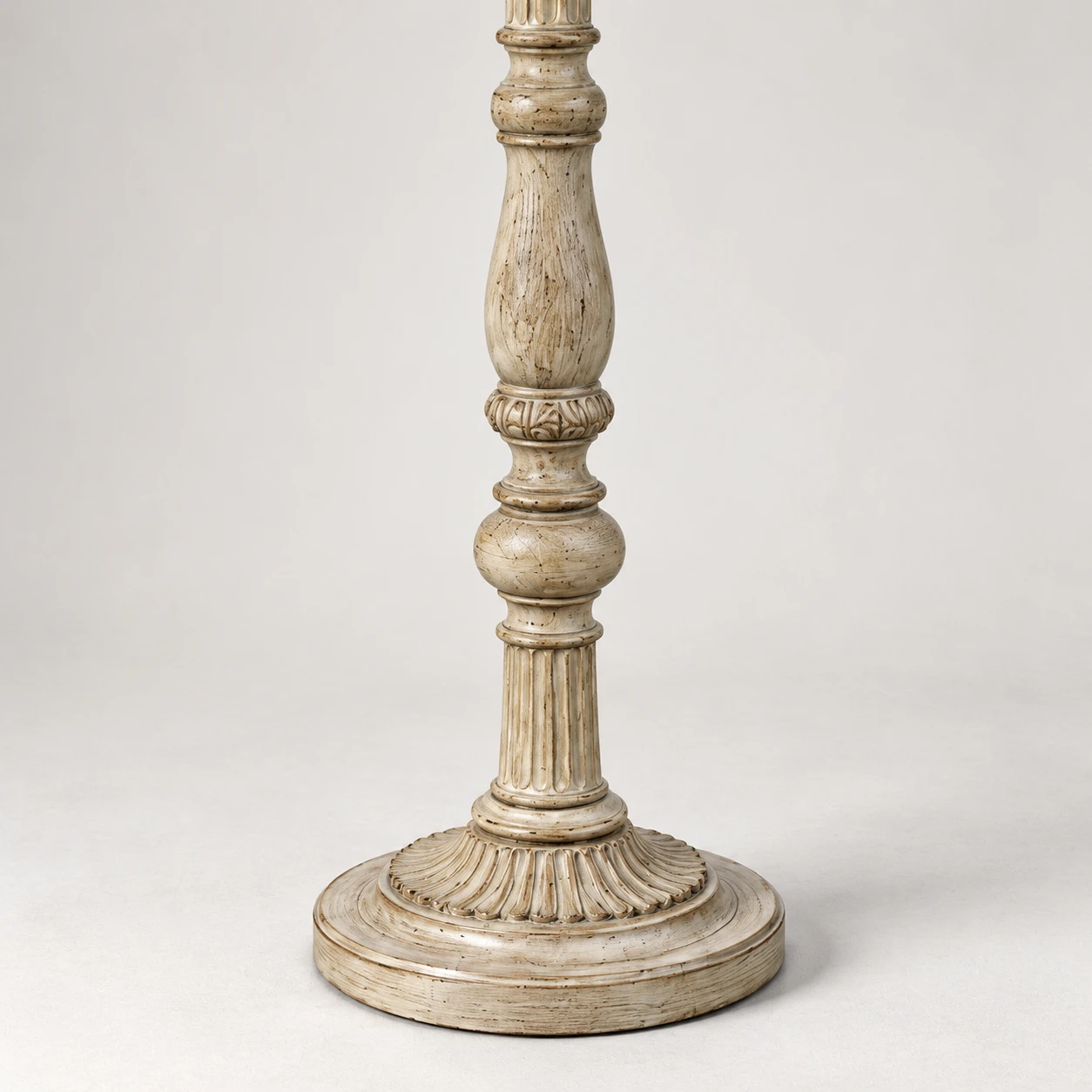 Grounded round carved wood floor base detail