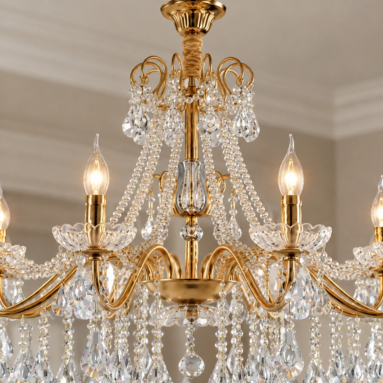 Close view of the chandelier center stem, canopy connection and crystal details