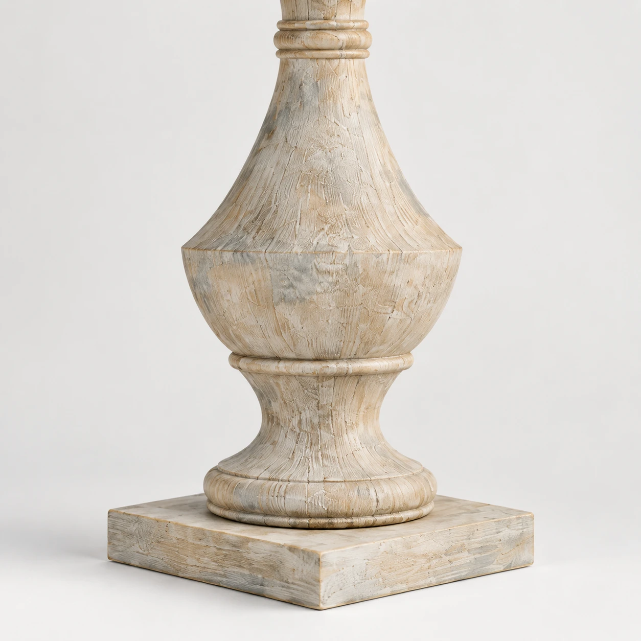 Stepped base and lower turned wood detail