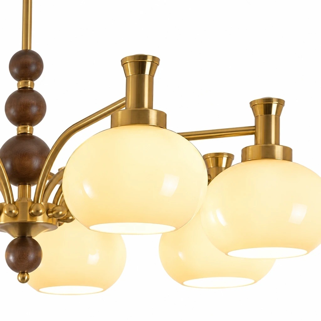 Close view of cream glass globe and brass arm