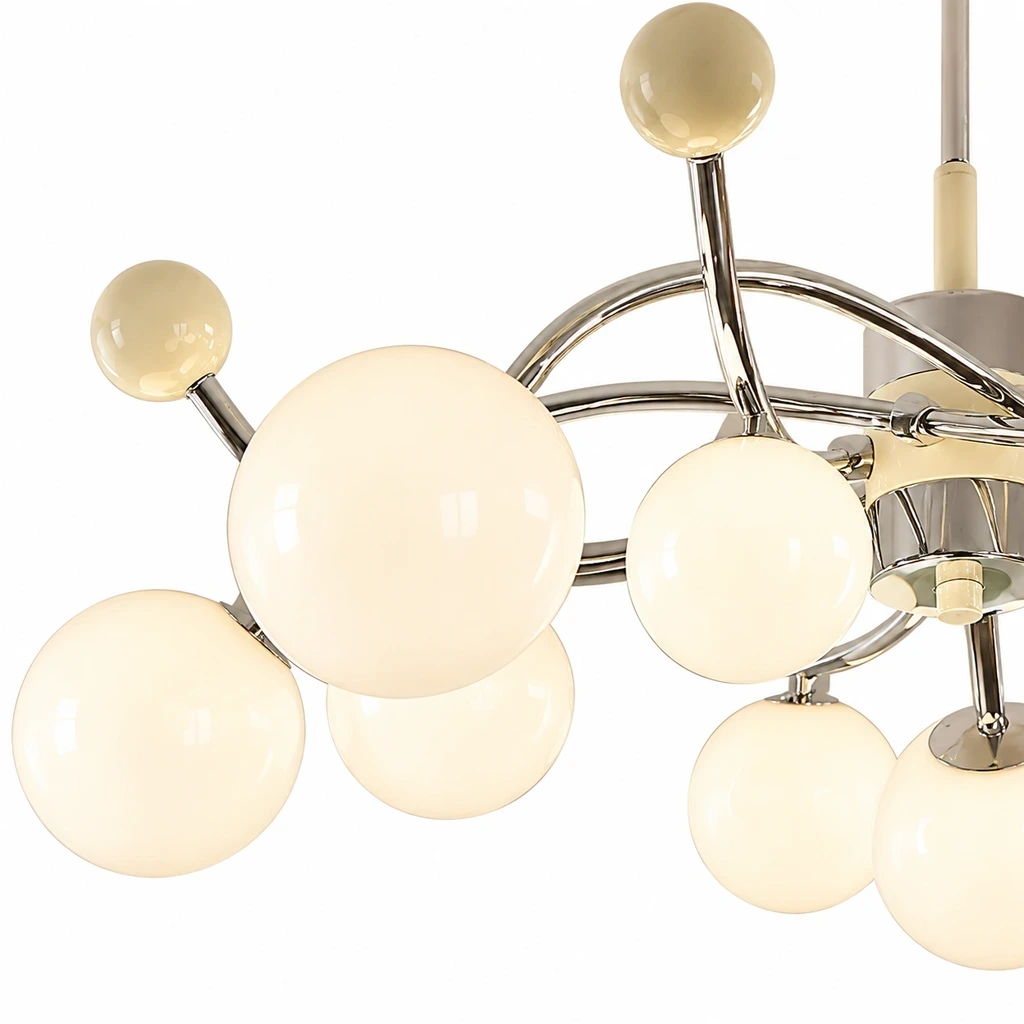 Existing close view of curved arms, finial and glass shades