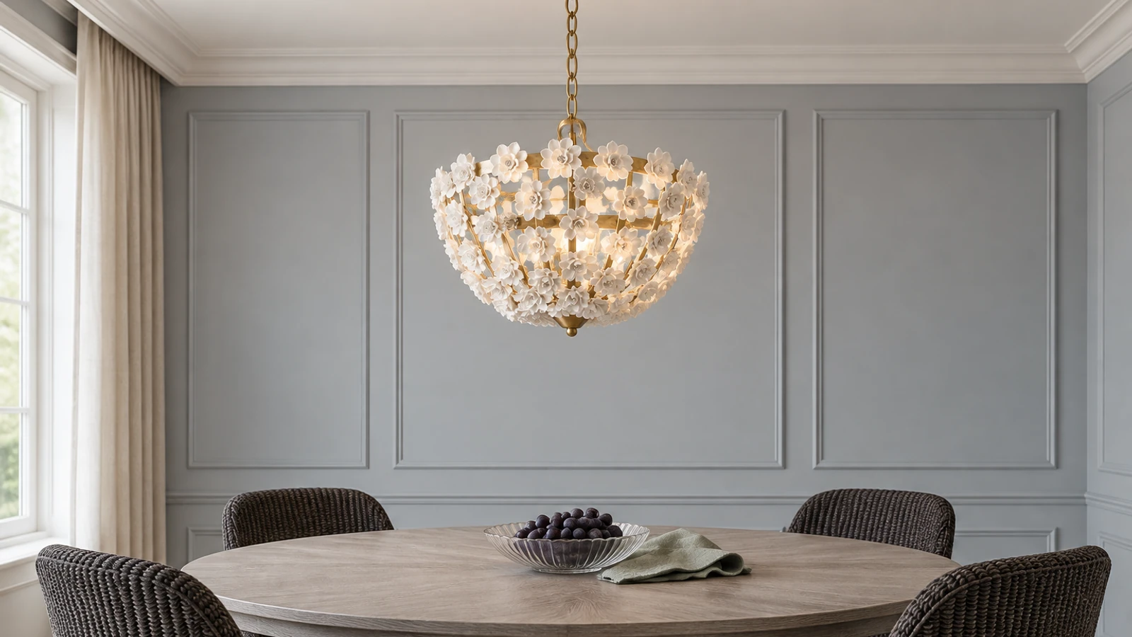 Floral ceramic chandelier above a dining table