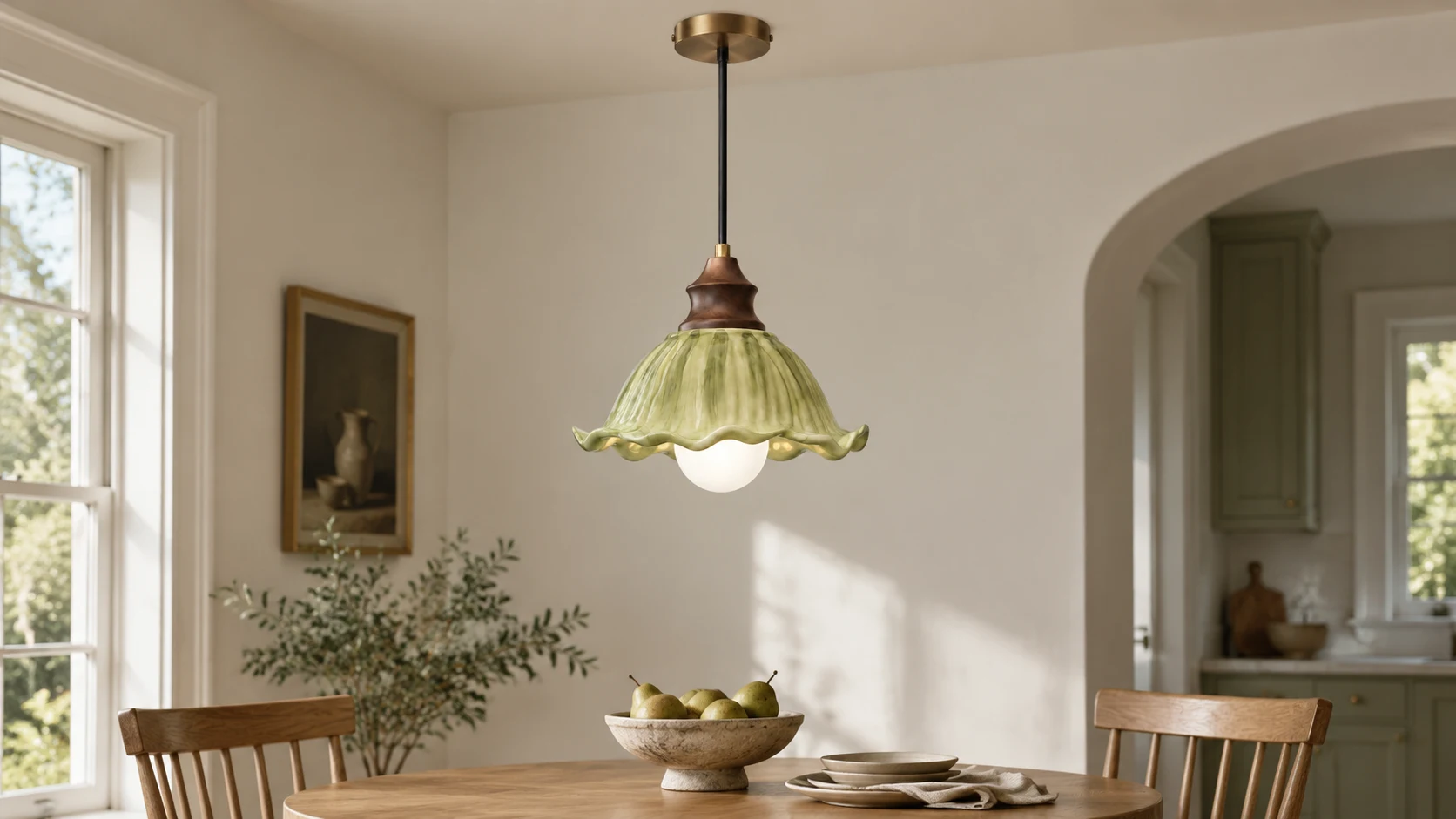 Single green glass pendant centered in a family dining nook