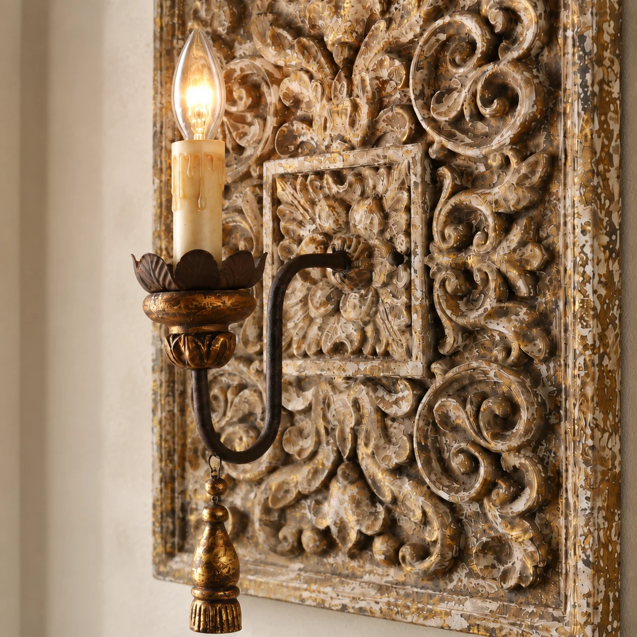 Candle holder and iron arm against carved panel