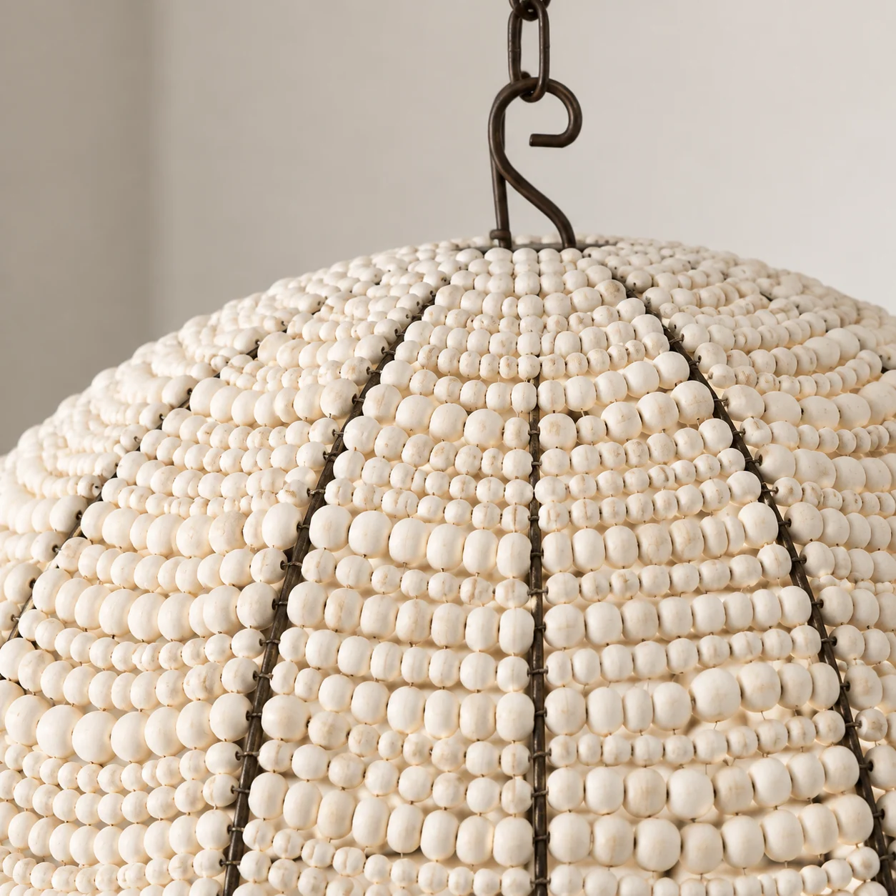 Ivory wooden beads and dark iron ribs