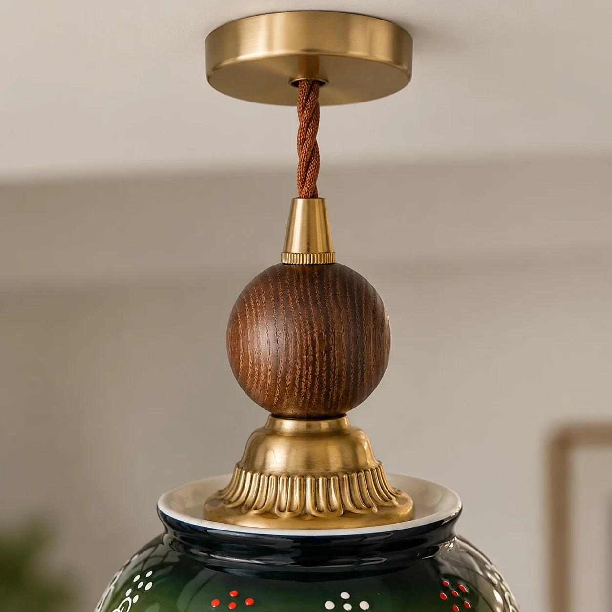 Turned walnut sphere and brass-tone fittings