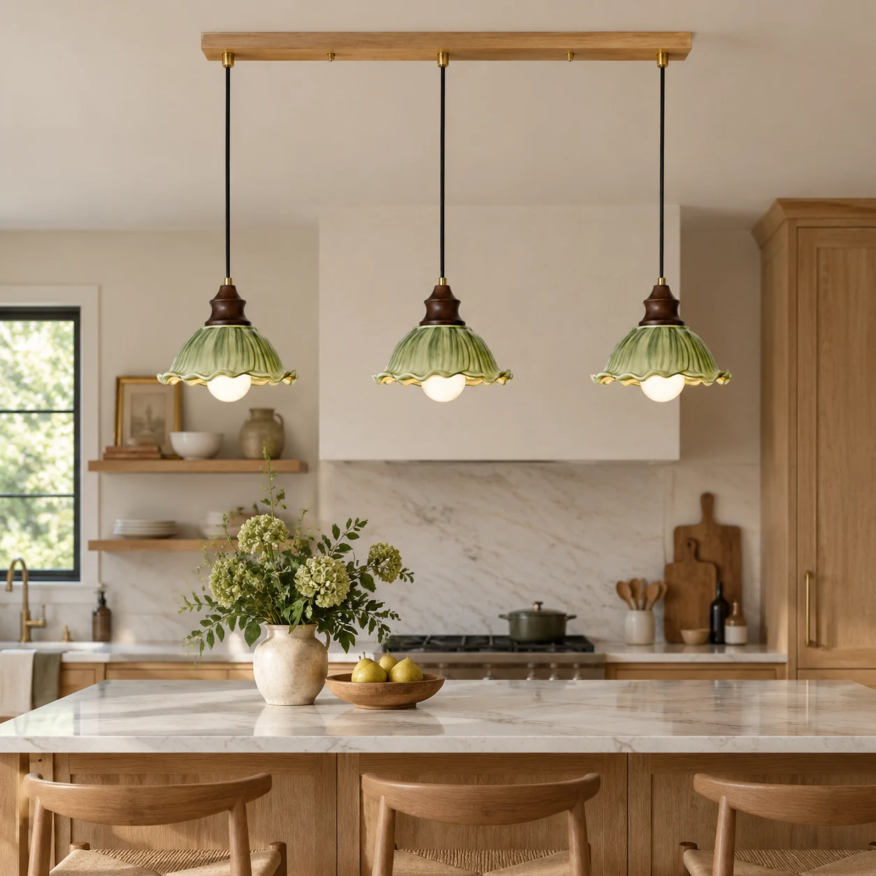 Three green glass pendants above kitchen island