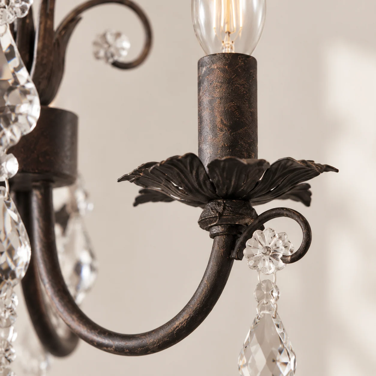 Dark iron candle holder and curled arm