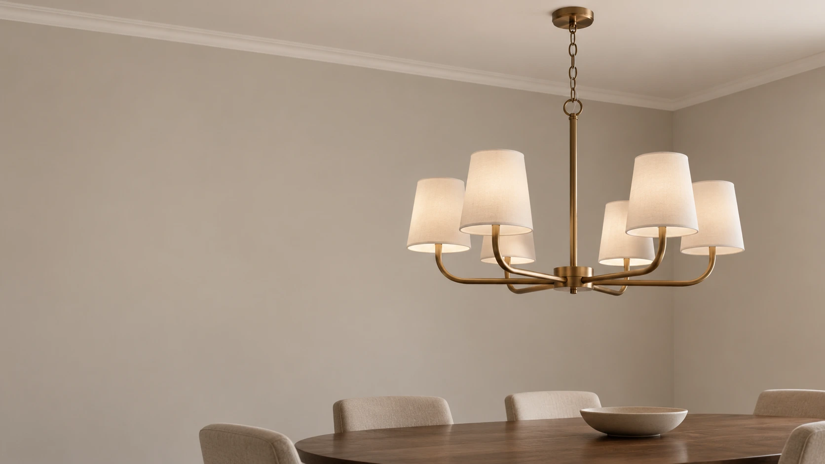 Antique bronze curved-arm iron chandelier in a dining room