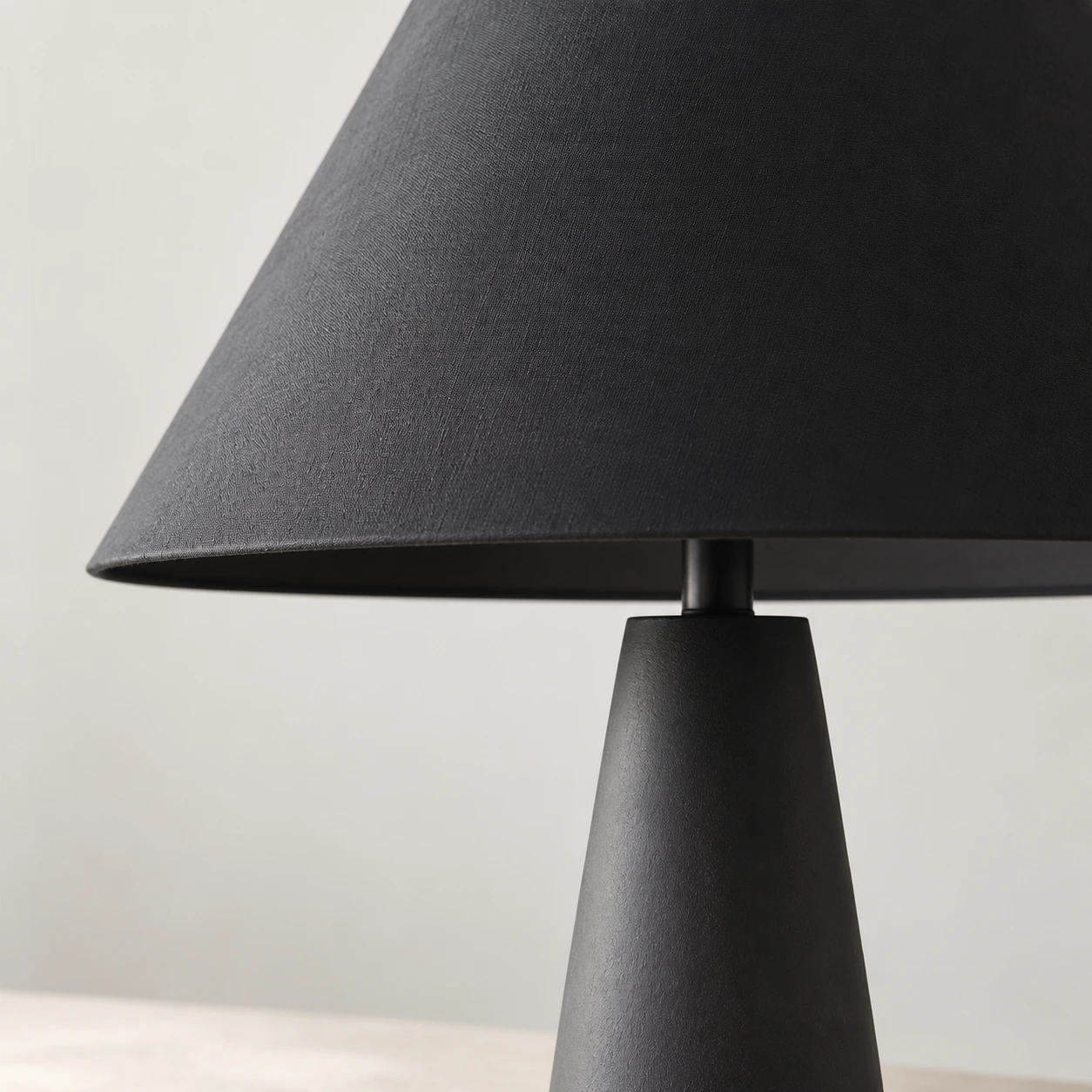 Close view of the black fabric shade weave and connector