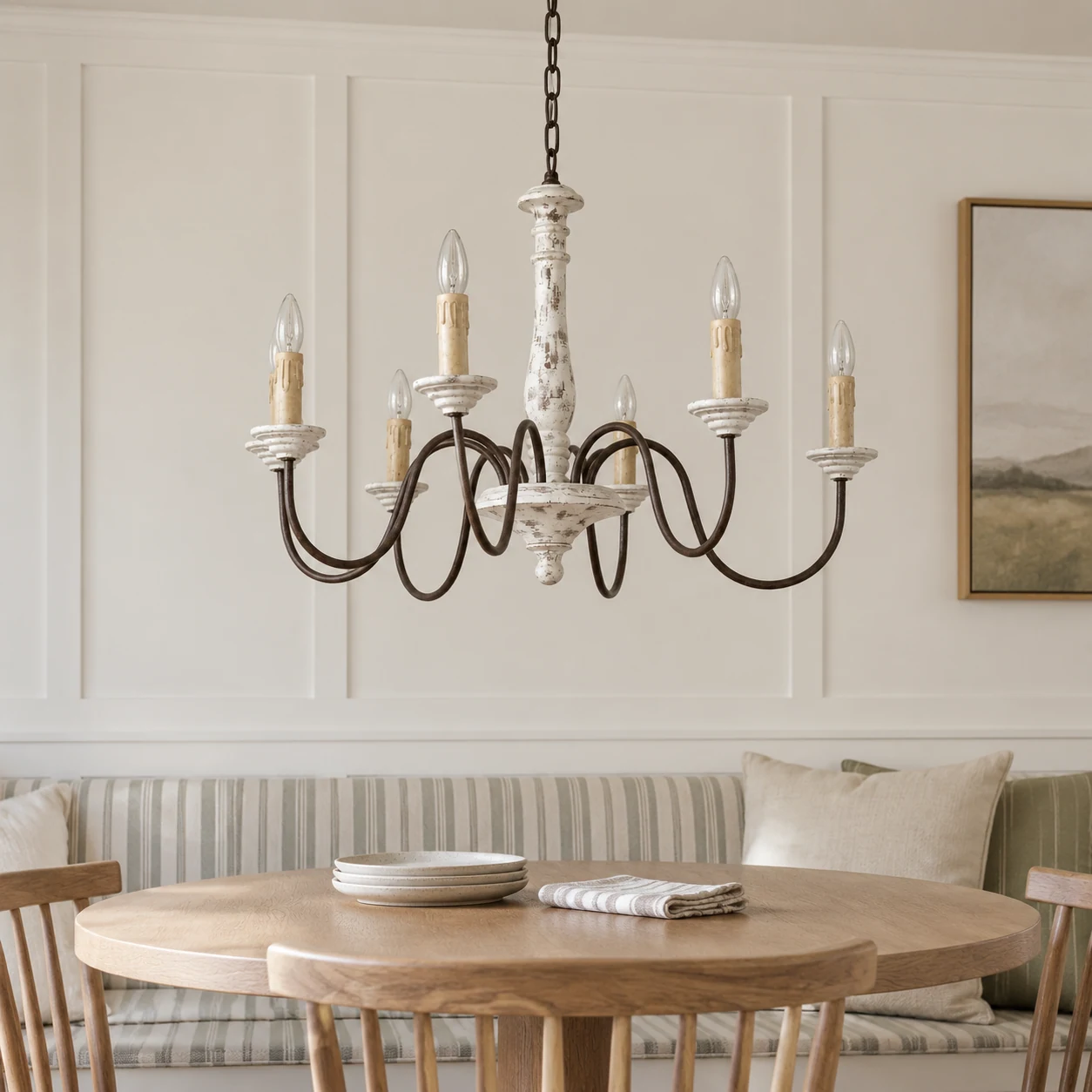 Distressed-white wood chandelier in a breakfast room