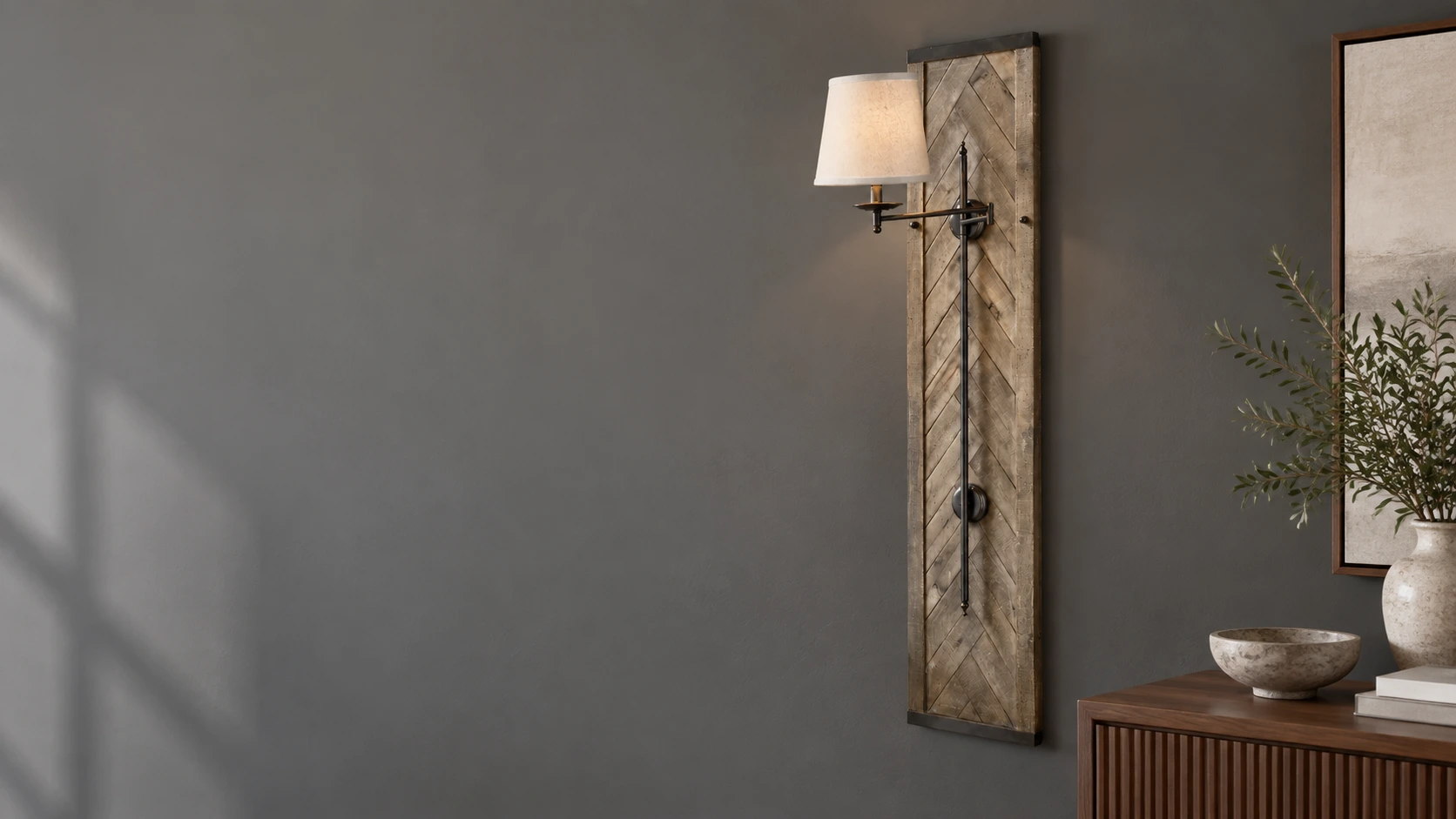 Tall chevron wood wall sconce in a dining room